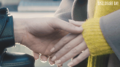 holding-hands-disclosure-day