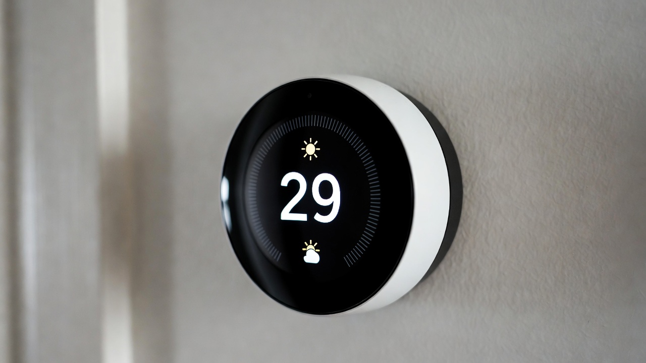 Google Nest Learning Thermostat 4th generation with large display showing temperature and weather