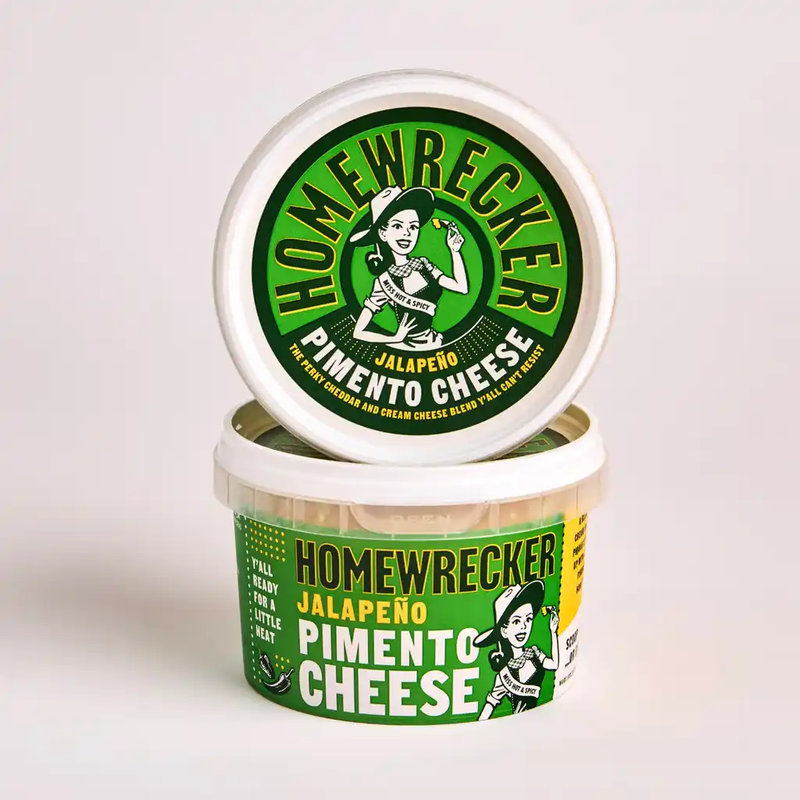 Homewrecker Jalapeño Pimento Cheese tub with its lid displayed above, against a cream background