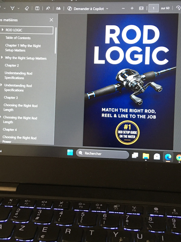 Bass angler opening the Bass Rod Logic guide on a laptop