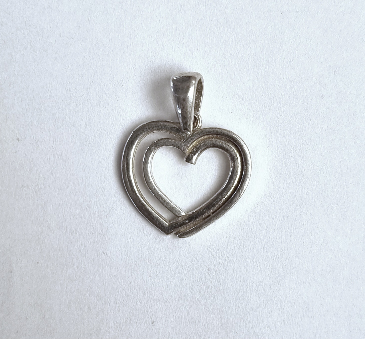 Dije corazón calado