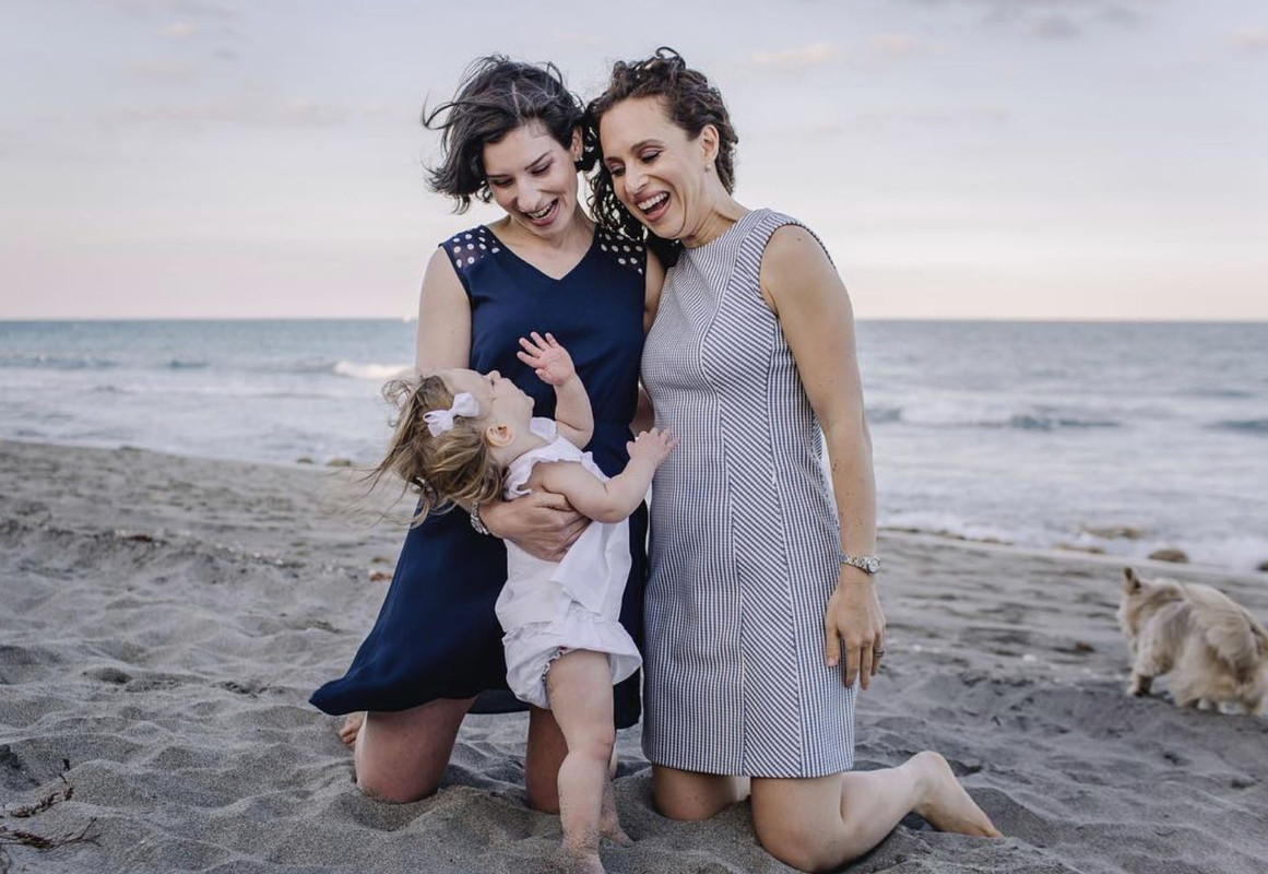 Lauren Baer with her daughter and partner