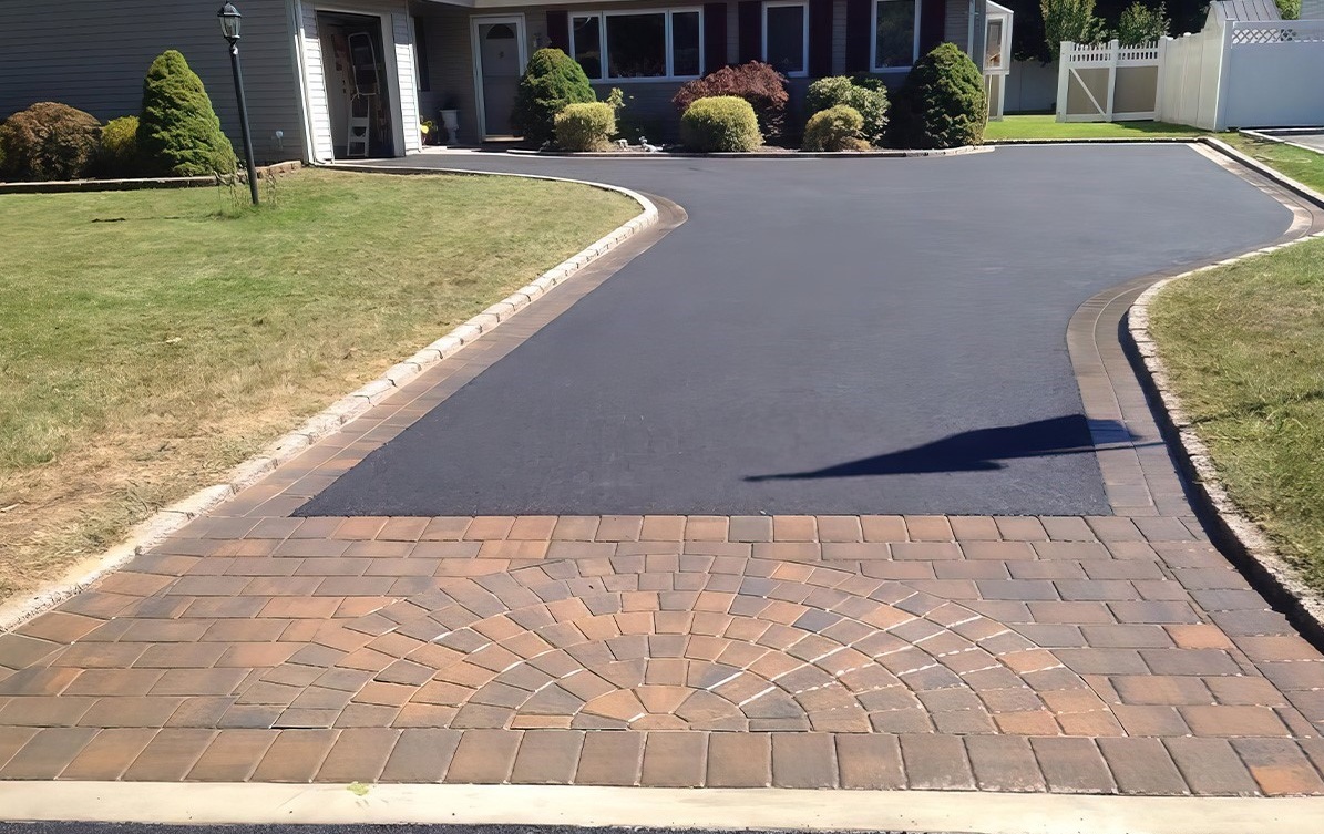 Finished asphalt driveway with decorative brick border in Nampa Idaho