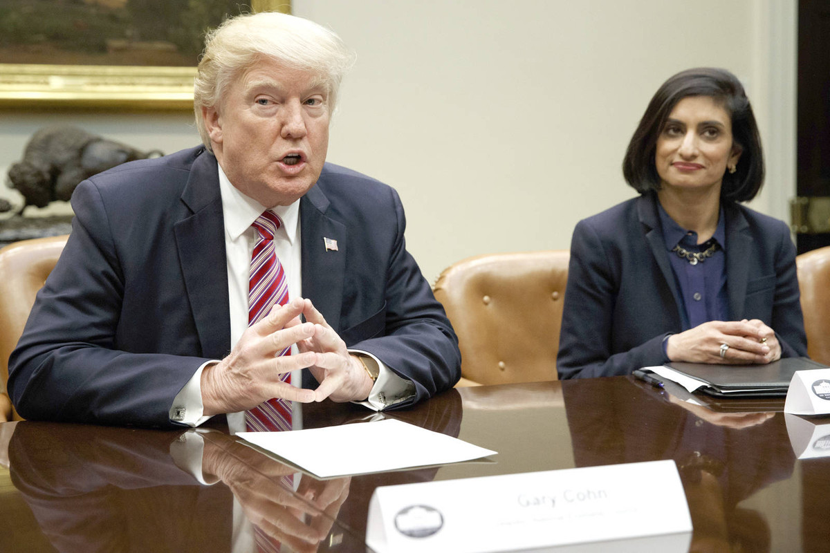 Seema Verma listens at right as President Donald Trump speaks during a meeting on women in healthcare on March 22, 2017, in the White House