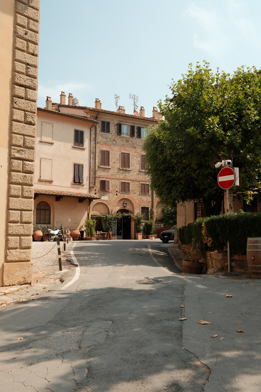 A small European town, old stone buildings along a quiet street