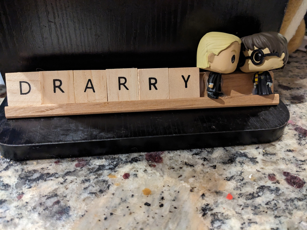 Draco and Harry pop vinyls with Scrabble letters