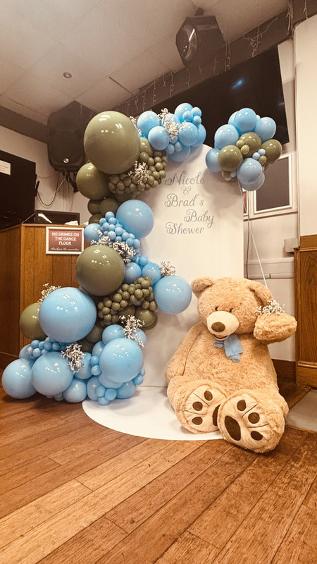 Balloon display with a big teddy bear