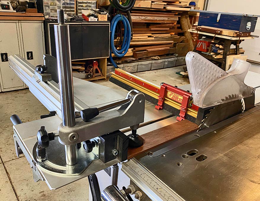 Eccentric hold down for K3 sliding table saw