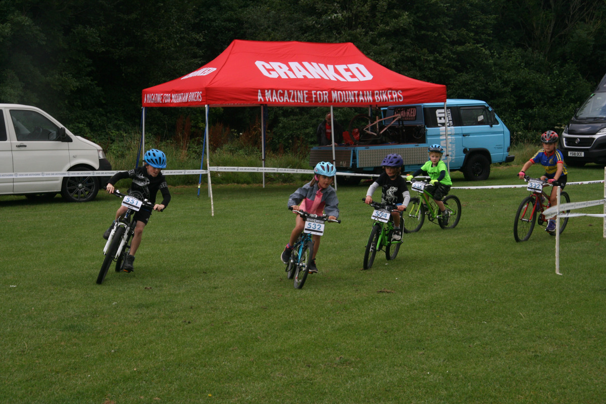 Little dogs racing round the final corner.