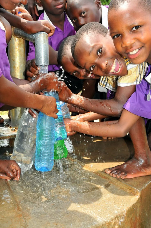 Children smiling at a community program