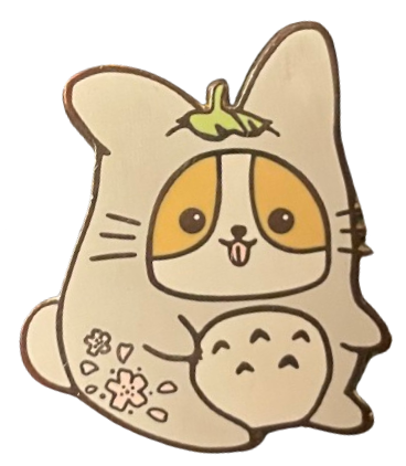 an enamel pin of a fat corgi with its tongue out wearing a totoro costume