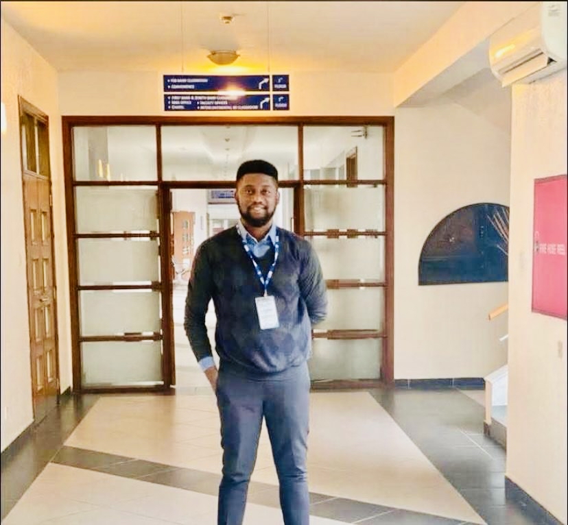 Smiling employee working on laptop