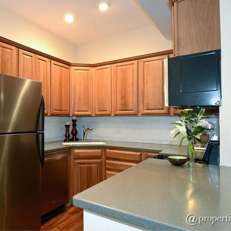 Before: Outdated Streeterville condo with closed layout and worn finishes
