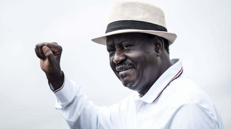 Raila Odinga shaking hands with President William Ruto in political alliance