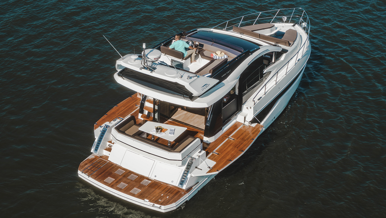 Beautiful tropical turquoise horizon with a white premium yacht