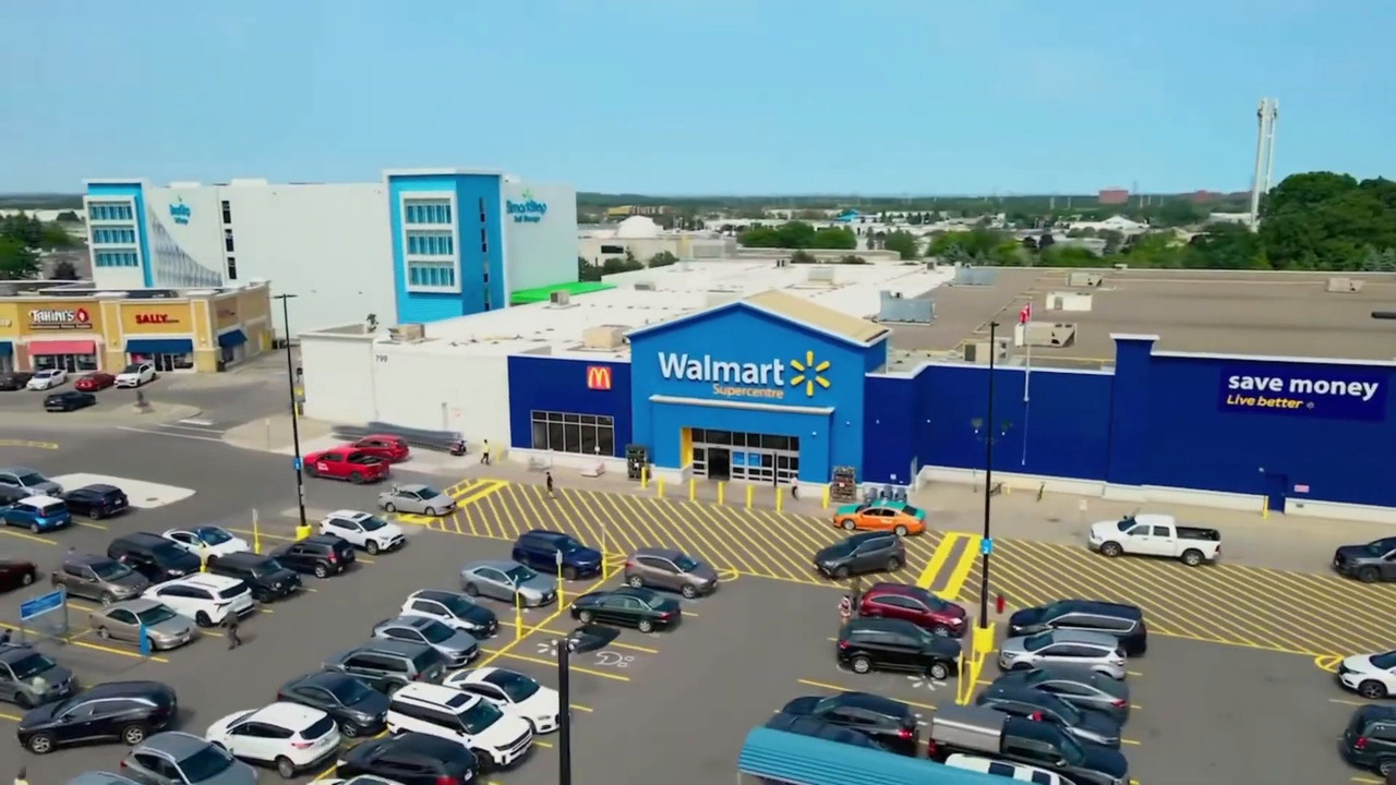 Aerial view of a Walmart Supercentre entrance with a freshly striped parking lot and new crosswalks
