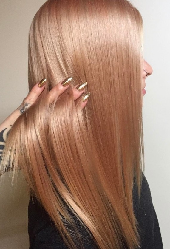 Golden melon color on long straight hair