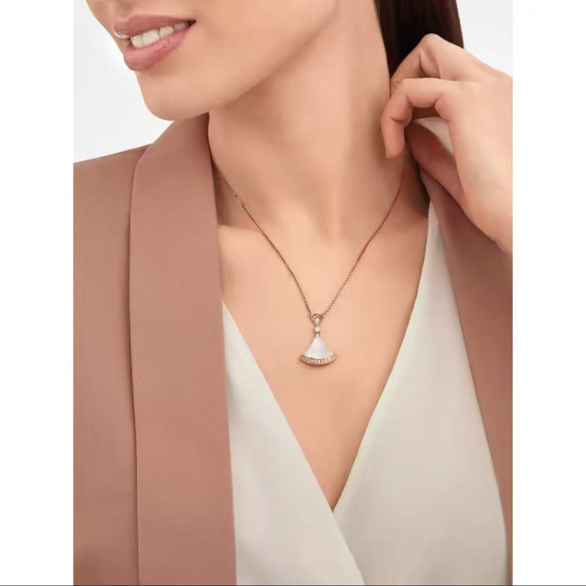 Fan shaped necklace worn by model