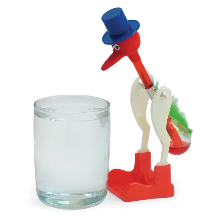 drinky bird next to cup