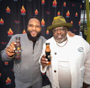 AC Barbeque founders Anthony Anderson and Cedric The Entertainer with AC Barbeque sauces — Black barbecue heritage and community