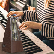 How to use a metronome for beginners - metronome beside instrument