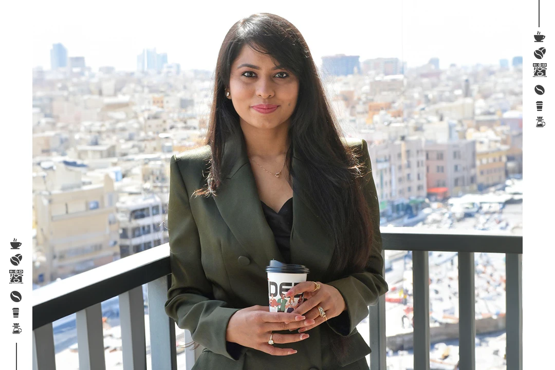 Woman holding espresso coffee cup