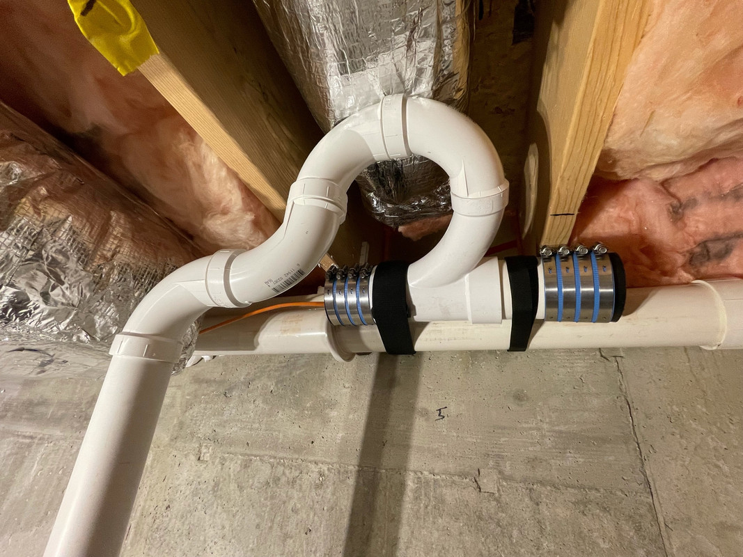 Tying basement sewage pump into main drain