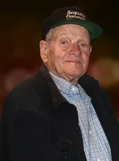 Terry-Bisson-photo-credit-Arley-Sorg-Locus-Publications-2022-bokeh-background-warm-tones