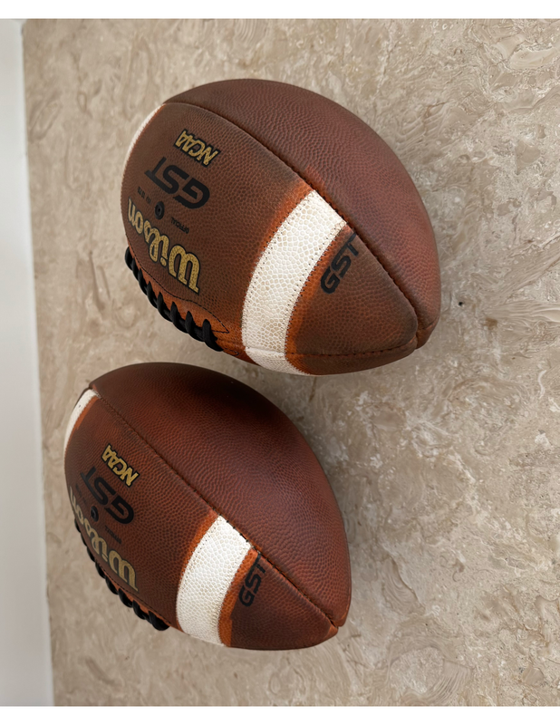 Pair of conditioned Wilson GST footballs