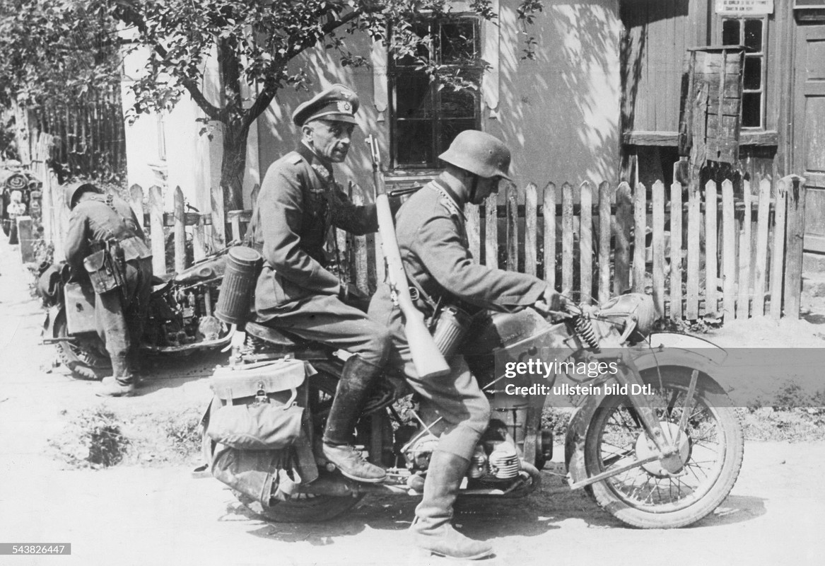 A general (commander of an army-corps) during a visit near the frontline on the back-seat of a motor