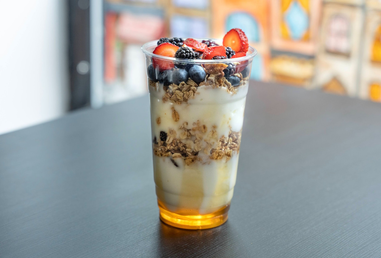 Yogurt parfait food photography with granola, berries, and honey for a Chicago restaurant menu