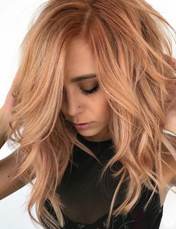 Golden melon color on long wavy messy hair