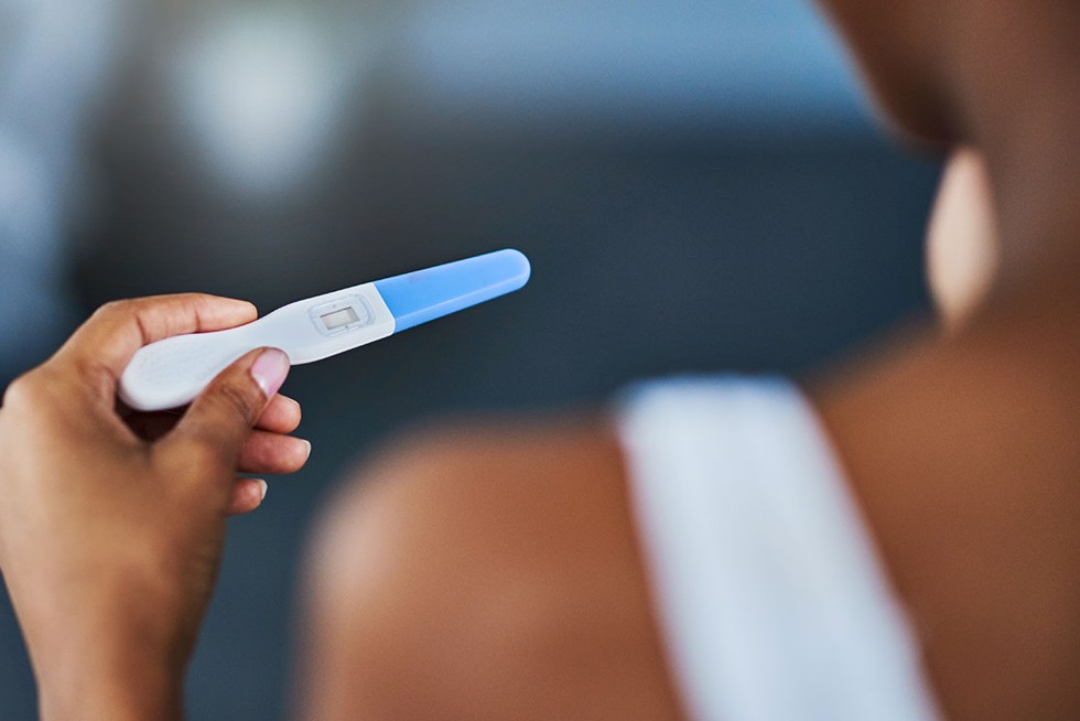 What should I do after receiving a positive pregnancy test