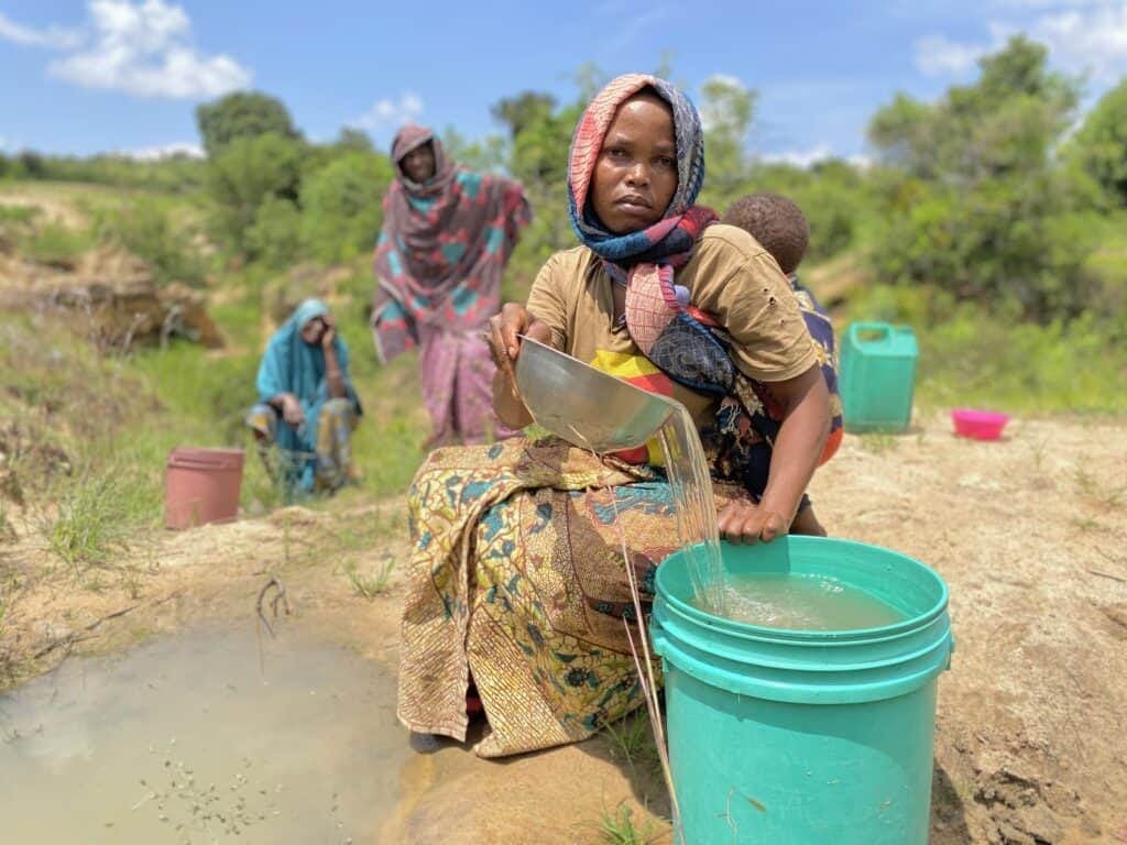 Woman collecting water