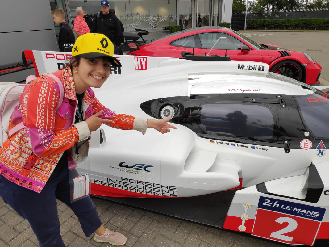 Hayley posing in front of a Porsche LMP1 car