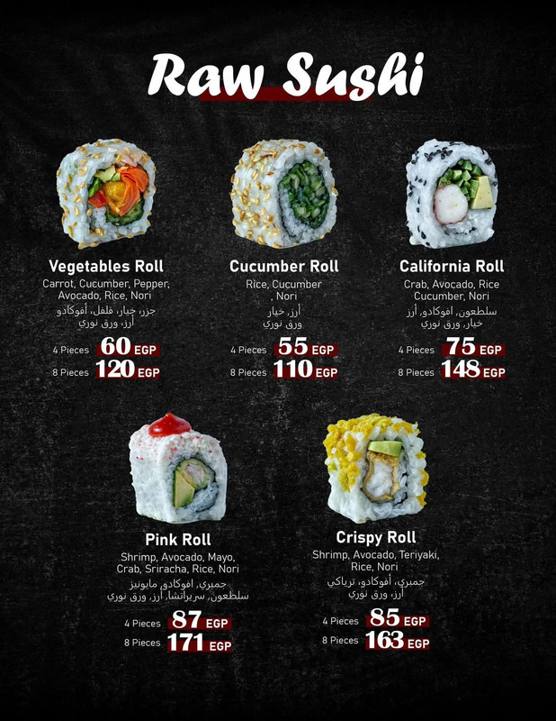 Beautifully arranged nigiri sushi on a black slate.