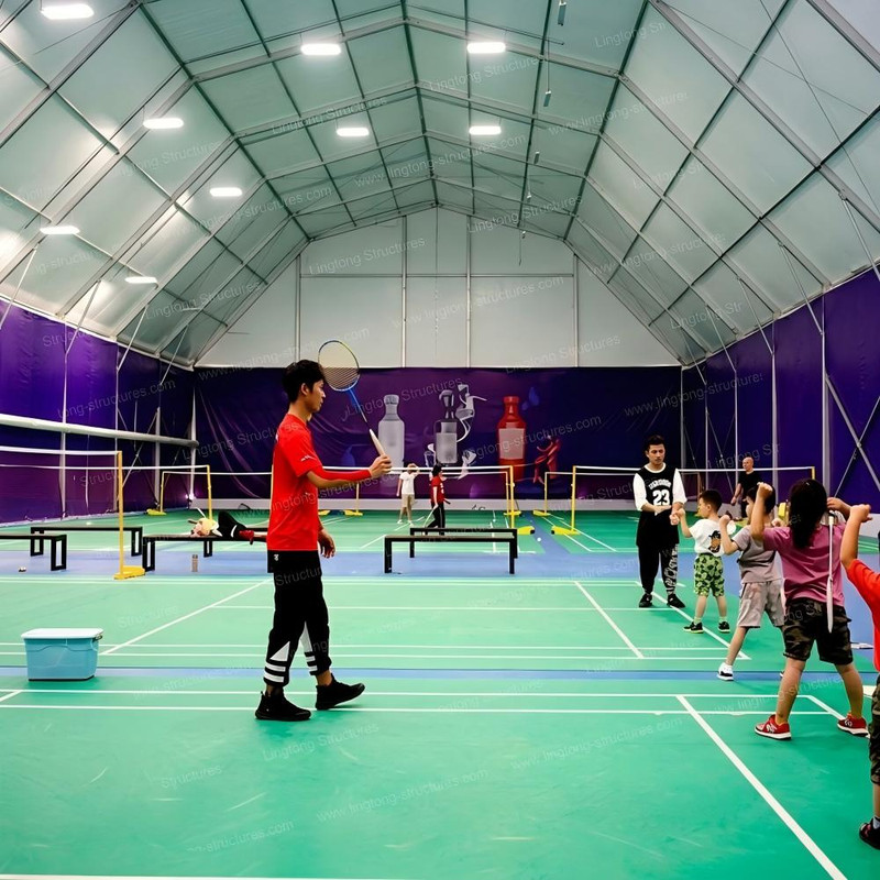 Indoor sports court tent with clear span interior for basketball, badminton and tennis training