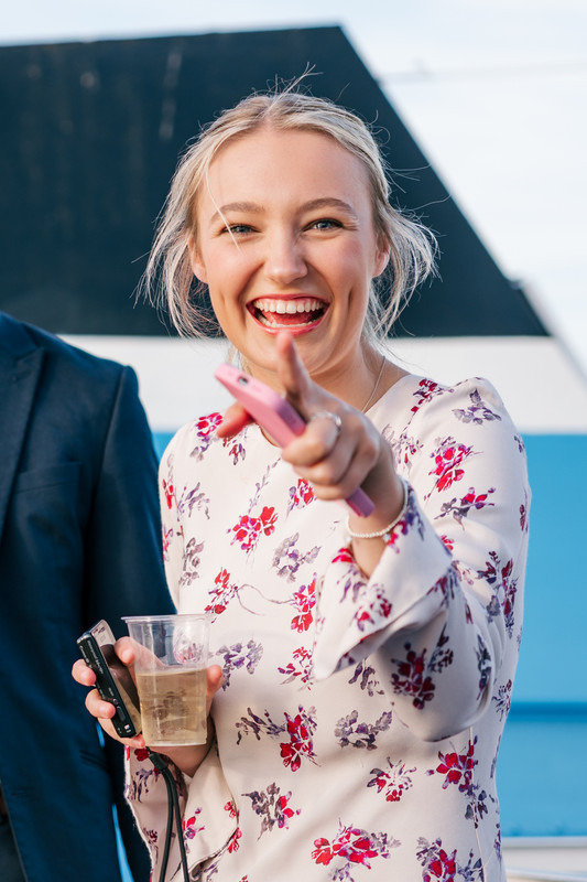 Students dancing and smiling at a university event