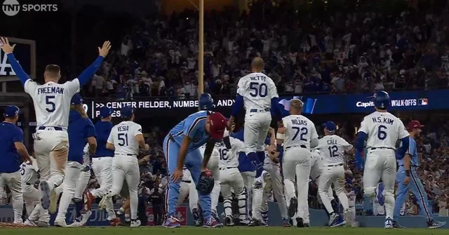 orion-kerkering-on-the-field-as-the-dodgers-celebrate-v0-wtbeeiyjz6uf1.webp