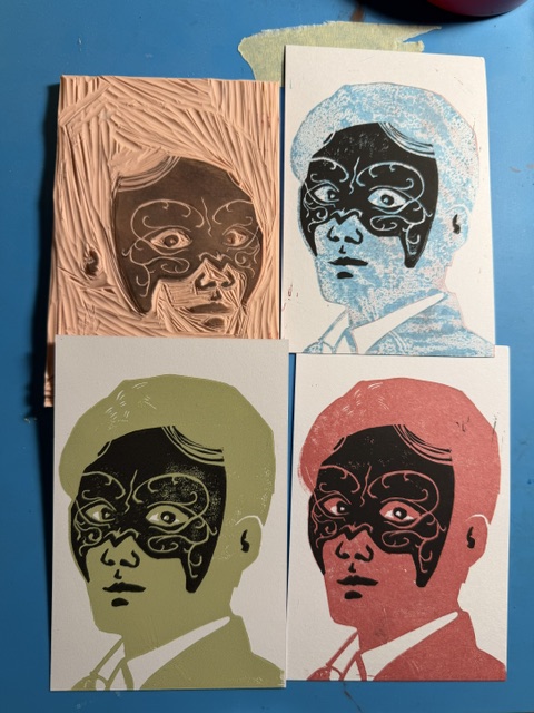 Lino block and collection of three prints, in different colors, of Shen Wei wearing the Heipaoshi mask.