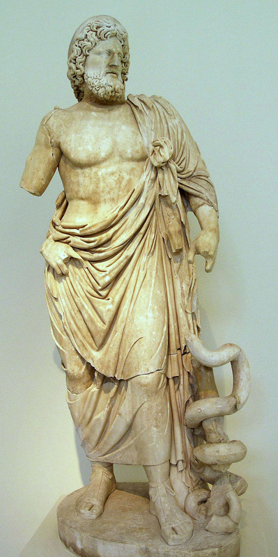 Denario de Caracalla, P M TR P XVI COS IIII P P. Serapis estante a izq. Roma. 800px-NAMA-Asklepios-Epidaure
