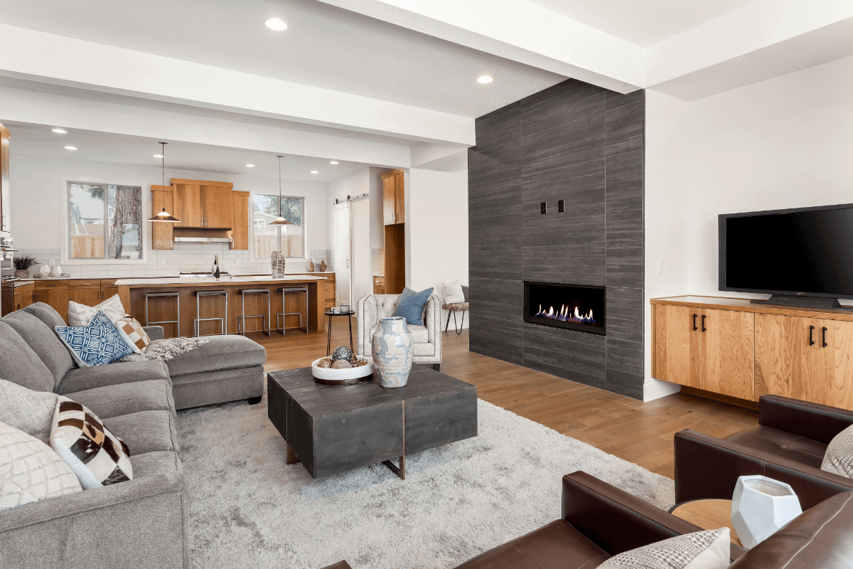 modern living room with fireplace and open concept kitchen
