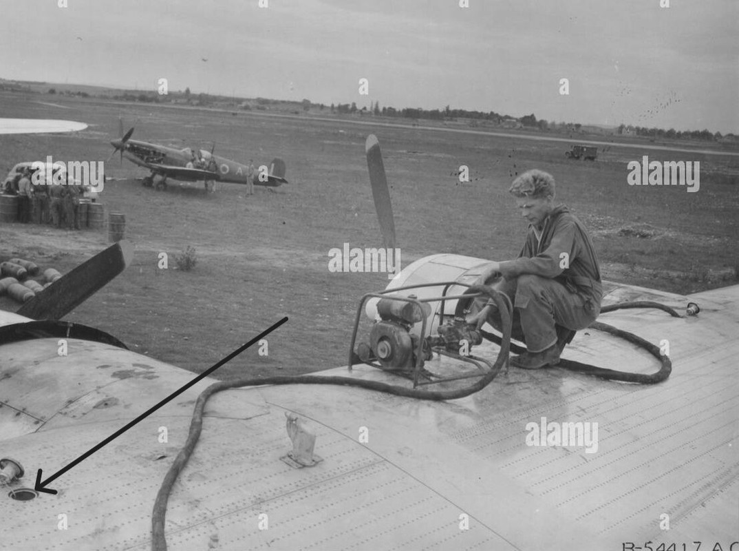france-engineer-of-consolidated-b-24-liberator-pumps-out-gas-from-wing-tank-of-bomber-at-lyons-2JXRM