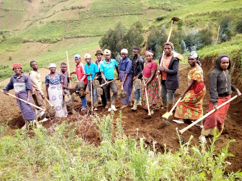 image of codel members hadling tools for the agriculture project