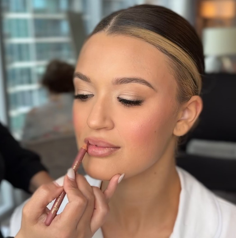 Natural bridal makeup with sleek bun