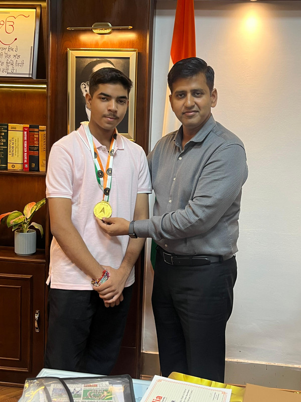 Raj receiving medal 1