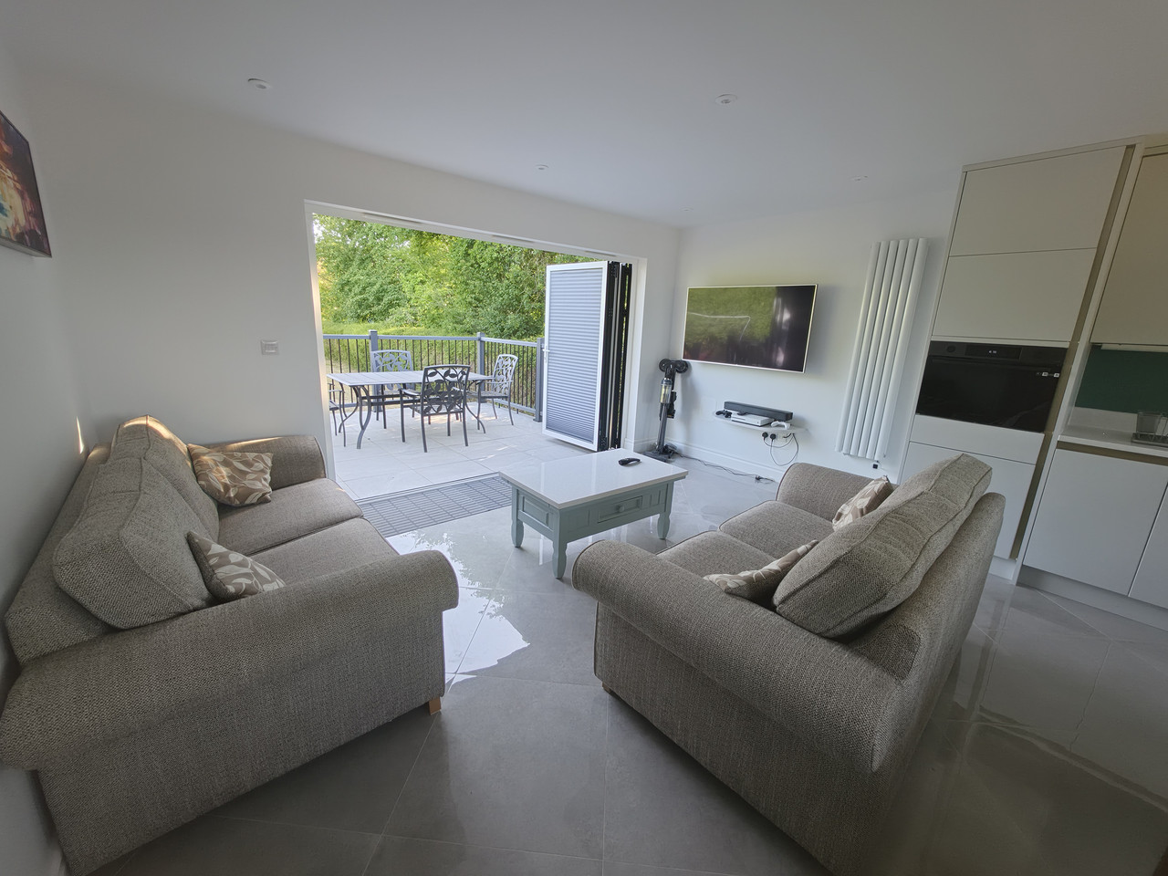 Seating area with bi-fold doors leading to private patio