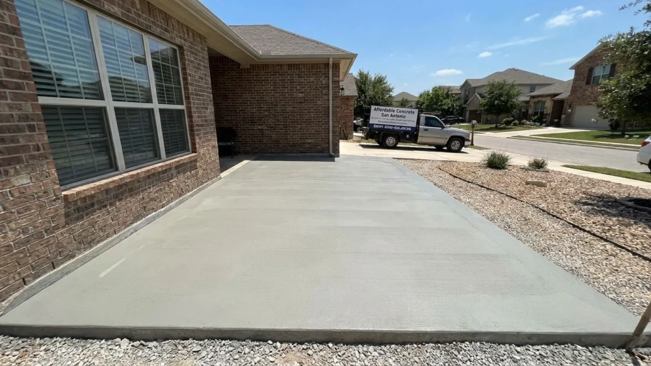 Clean finished concrete patio after professional repair by Affordable Concrete San Antonio showing smooth surface and correct drainage slope away from house