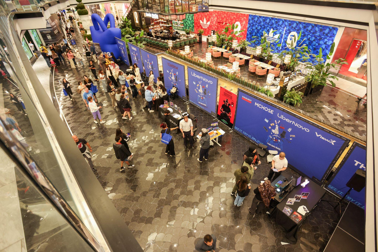 An overview of THE BIG BAG at American Dream in New Jersey, featuring participating brand booths and attendees throughout the event space.