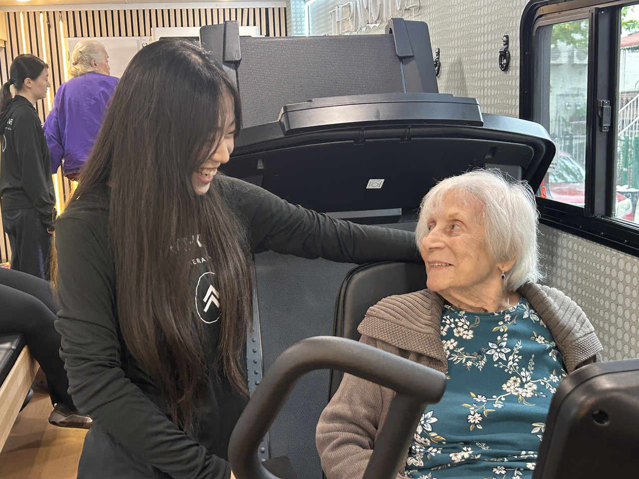 TheraMotive clinician assisting an older adult